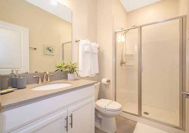 bathroom featuring vanity, tile patterned floors, and walk in shower