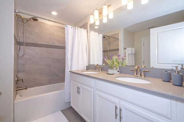 bathroom with shower / bath combo and vanity