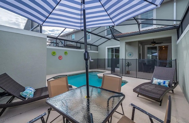 view of pool featuring ceiling fan and a patio area