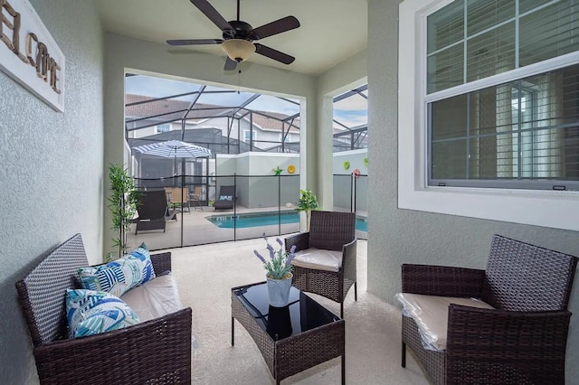 view of patio / terrace featuring a lanai, ceiling fan, and an outdoor hangout area