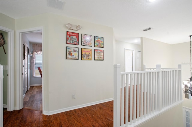 hall with dark hardwood / wood-style flooring