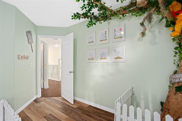 interior space with hardwood / wood-style flooring and radiator