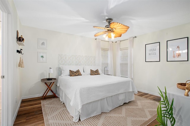 bedroom with ceiling fan and wood-type flooring