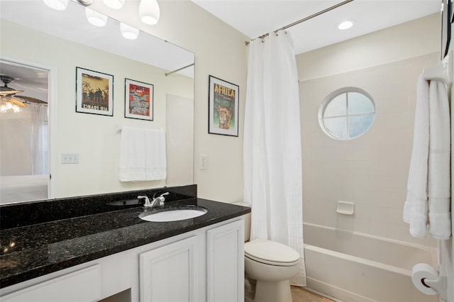 full bathroom featuring shower / bath combination with curtain, vanity, toilet, and ceiling fan