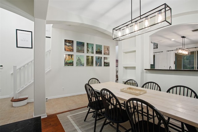 dining area featuring tile patterned flooring