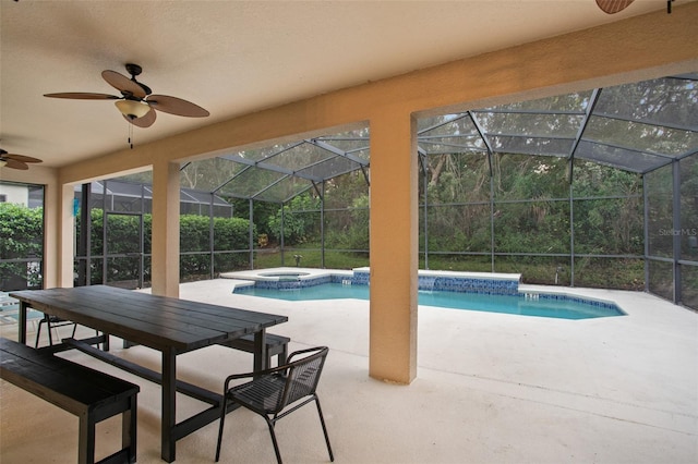 view of swimming pool with a lanai, a patio area, an in ground hot tub, and ceiling fan