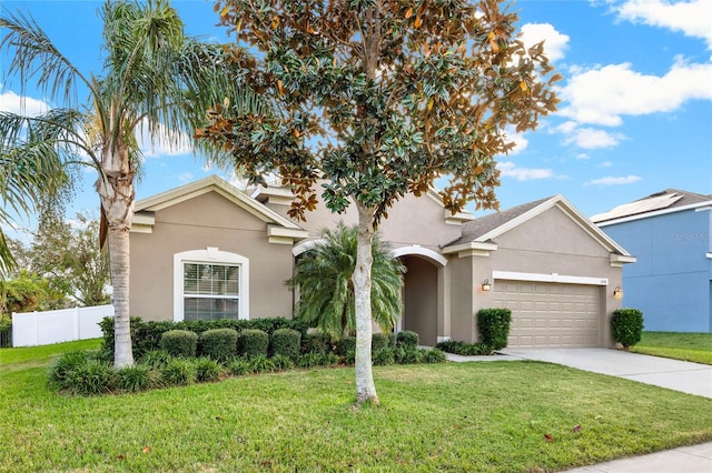 single story home with a front yard and a garage