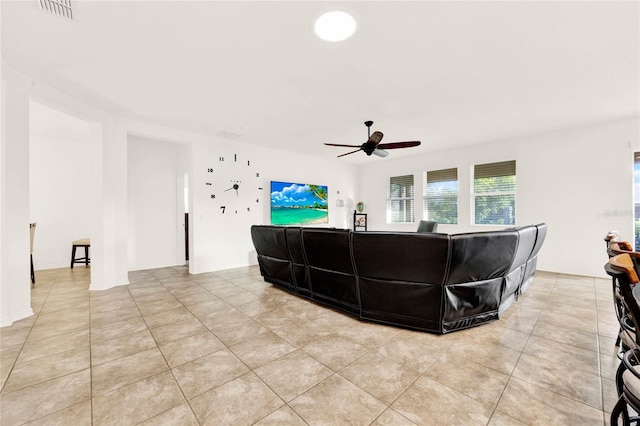 living room with ceiling fan and light tile patterned floors