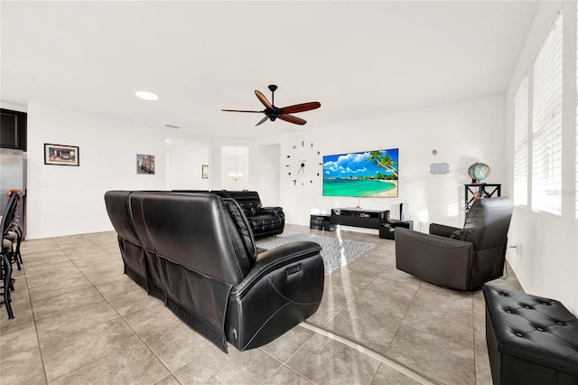 living room with ceiling fan and light tile patterned flooring