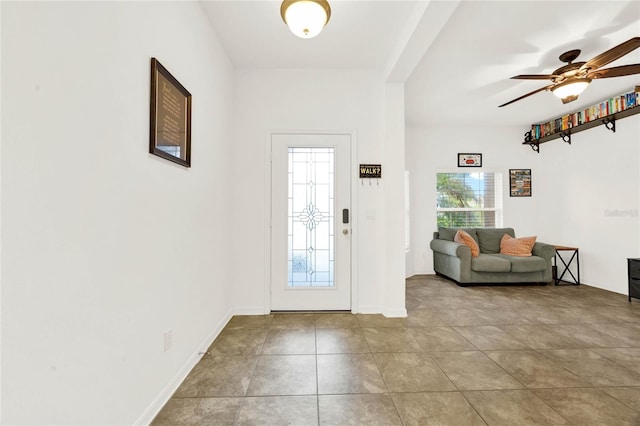 foyer featuring ceiling fan and light tile patterned flooring