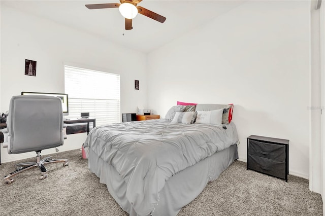 bedroom featuring ceiling fan, light carpet, and vaulted ceiling