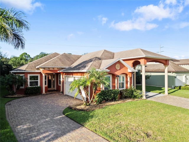 view of front of house with a garage and a front yard