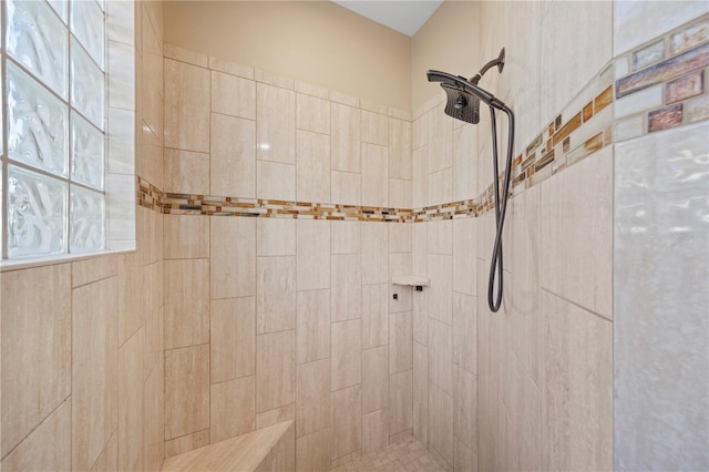 bathroom with tiled shower