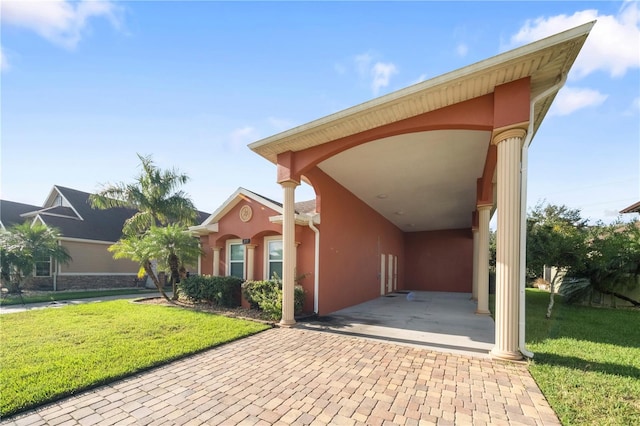 exterior space with a carport