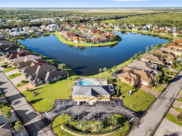 birds eye view of property with a water view