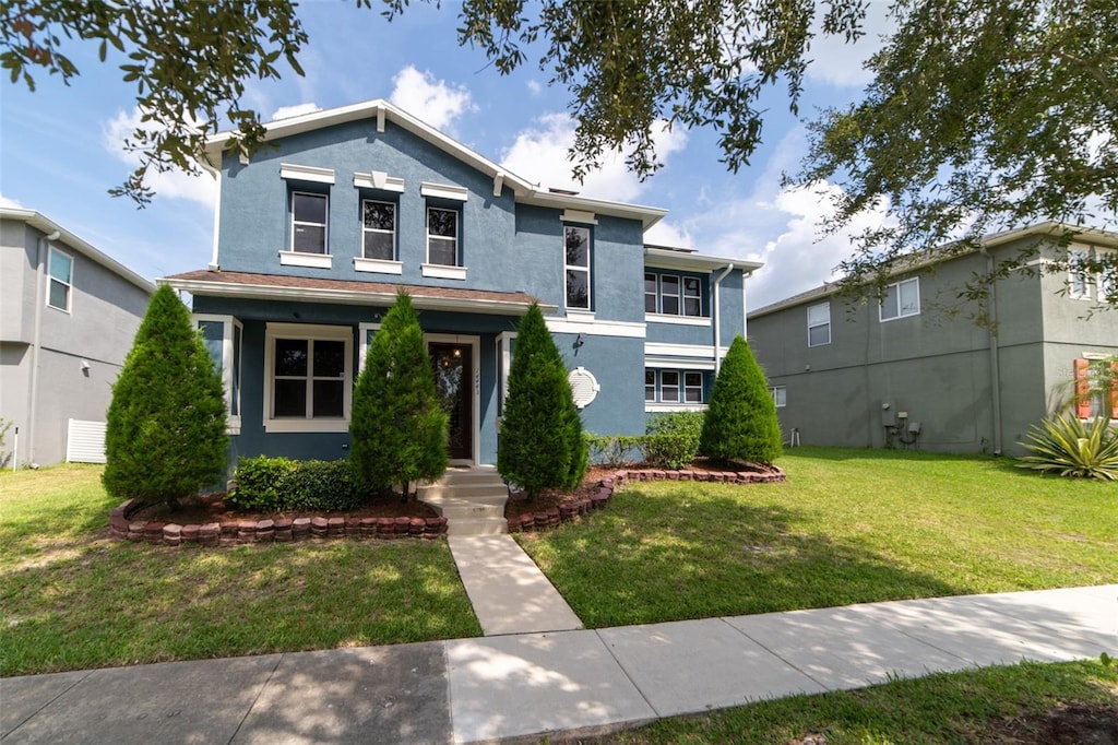 front facade with a front lawn