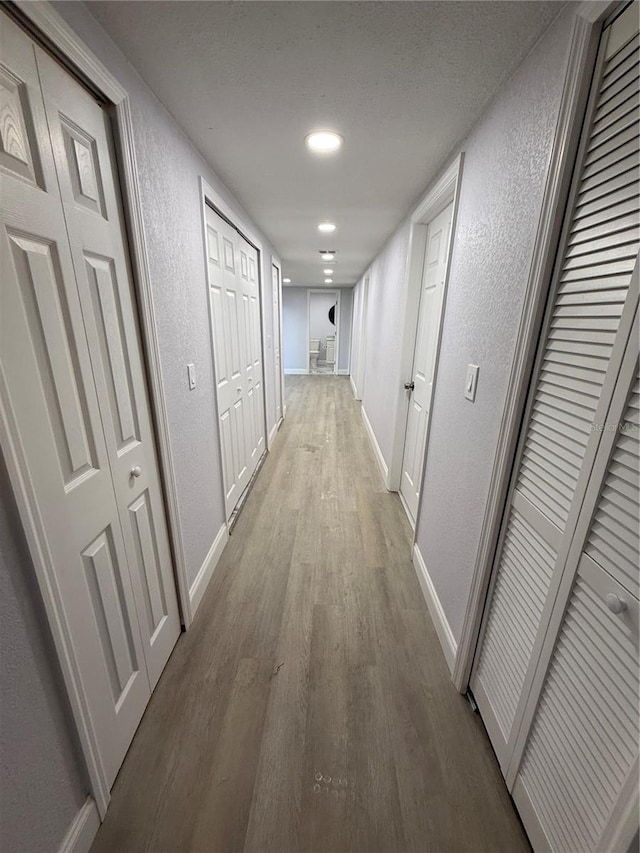 hall featuring hardwood / wood-style flooring