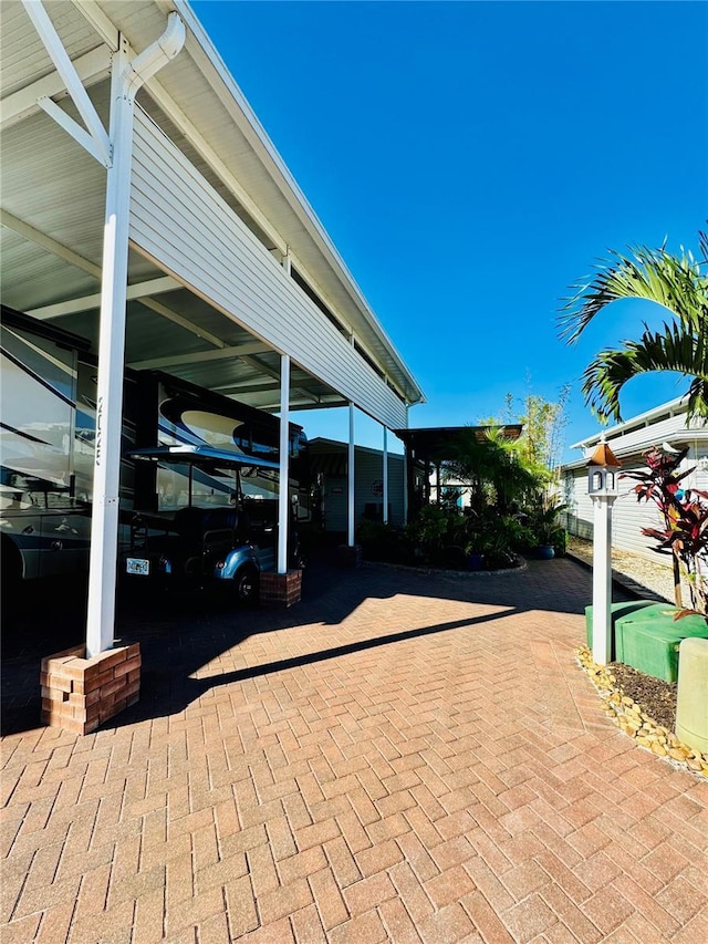 view of patio / terrace featuring a carport