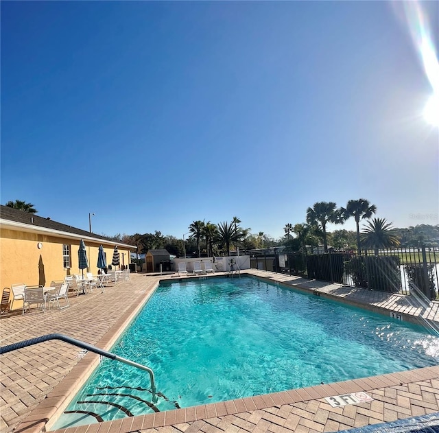 view of swimming pool with a patio