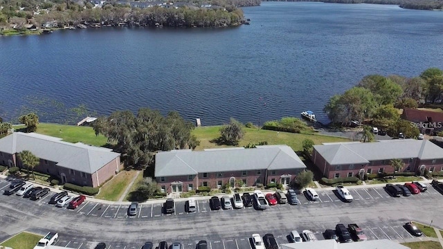 birds eye view of property with a water view