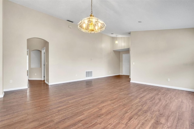 unfurnished room featuring hardwood / wood-style flooring and a textured ceiling