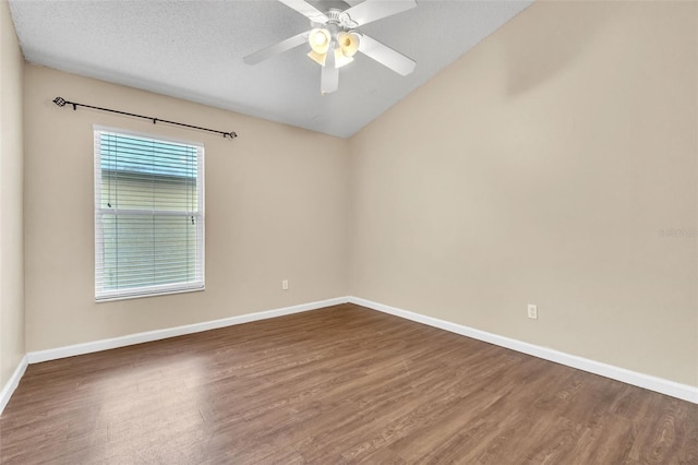 spare room with ceiling fan, wood-type flooring, and a textured ceiling