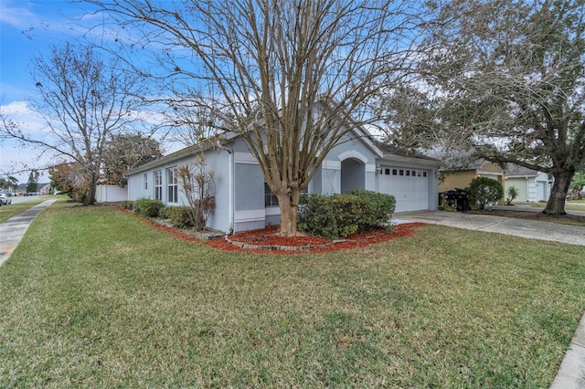 ranch-style house with a garage and a front lawn