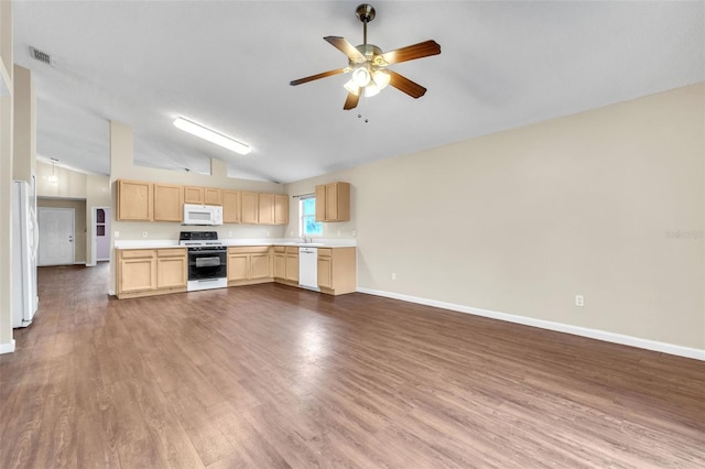 kitchen featuring vaulted ceiling, light brown cabinetry, hardwood / wood-style flooring, ceiling fan, and white appliances