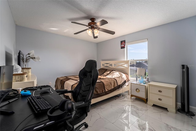 bedroom featuring a textured ceiling and ceiling fan