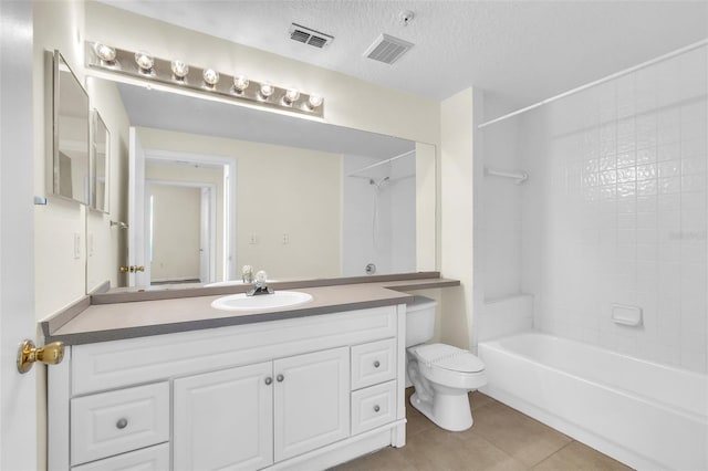 full bathroom featuring shower / bathtub combination, vanity, toilet, tile patterned floors, and a textured ceiling