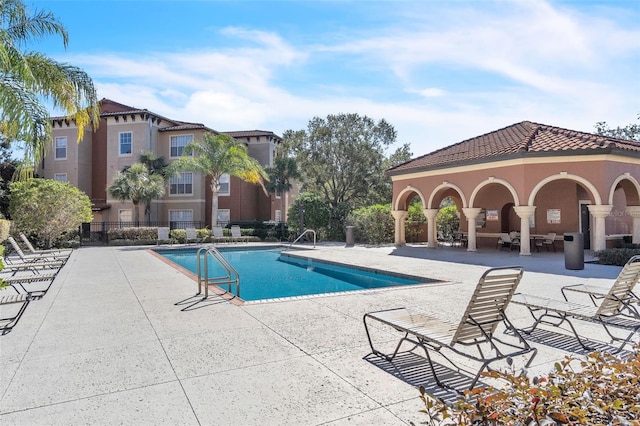 view of swimming pool featuring a patio area