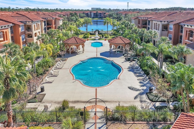 view of swimming pool with a gazebo, a patio, and a water view