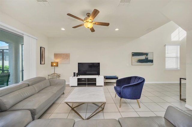 2468 Dubai St, Kissimmee, FL 34747 - tiled living area with a ceiling fan and recessed lighting