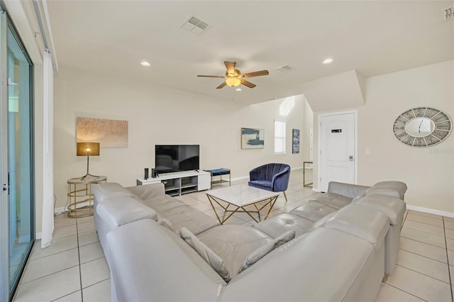 tiled living room with ceiling fan