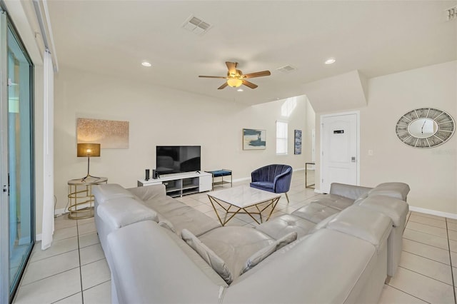 2468 Dubai St, Kissimmee, FL 34747 - living area with light tile patterned flooring, ceiling fan, and recessed lighting