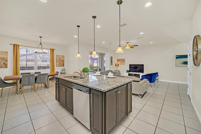 kitchen with dark brown cabinetry, ceiling fan, dishwasher, light stone countertops, and decorative light fixtures