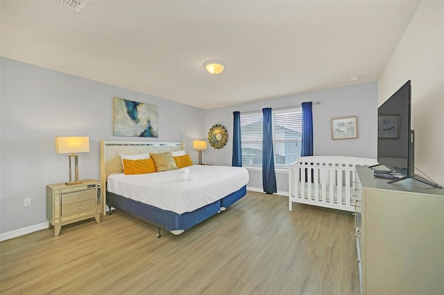 bedroom featuring light hardwood / wood-style floors