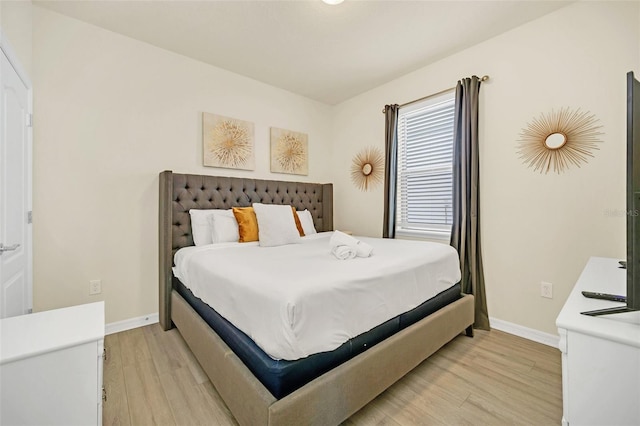 2468 Dubai St, Kissimmee, FL 34747 - bedroom with light wood-type flooring and baseboards