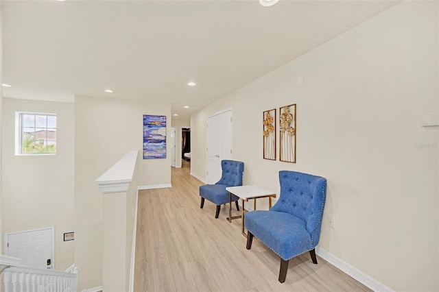2468 Dubai St, Kissimmee, FL 34747 - sitting room featuring an upstairs landing, light wood finished floors, and recessed lighting