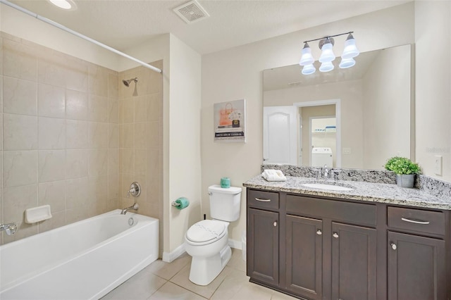 2468 Dubai St, Kissimmee, FL 34747 - full bathroom featuring tile patterned floors,  shower combination, vanity, and washer / dryer