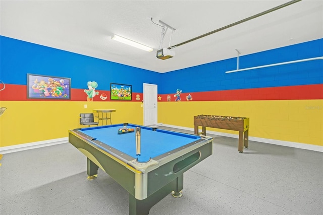 2468 Dubai St, Kissimmee, FL 34747 - game room featuring speckle patterned floor, pool table, and a garage