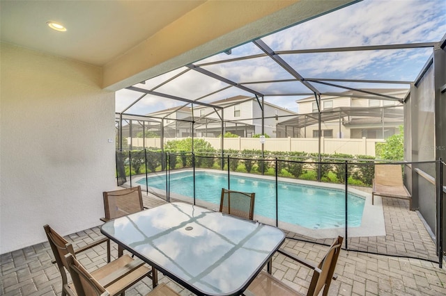 view of pool featuring a lanai and a patio area