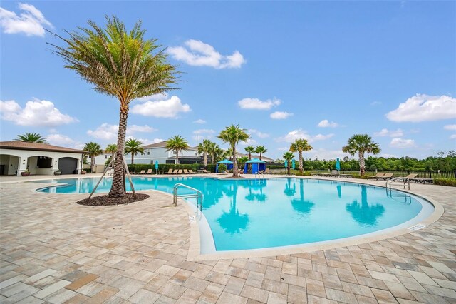 view of swimming pool featuring a patio