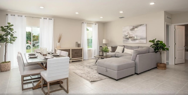 tiled living room featuring a wealth of natural light