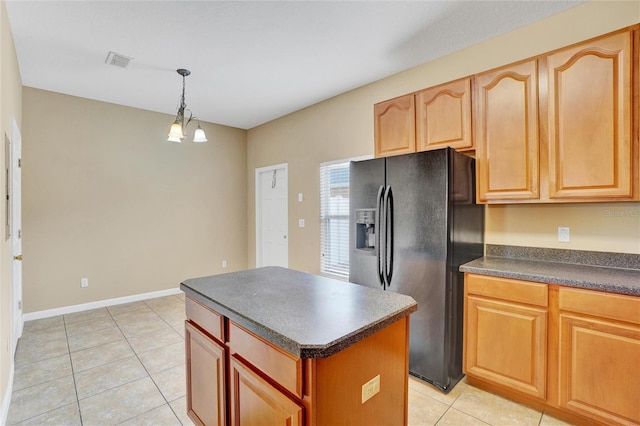 kitchen featuring a center island, pendant lighting, a chandelier, black fridge with ice dispenser, and light tile patterned floors