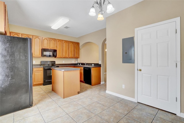 kitchen featuring pendant lighting, light tile patterned flooring, electric panel, black appliances, and a kitchen island