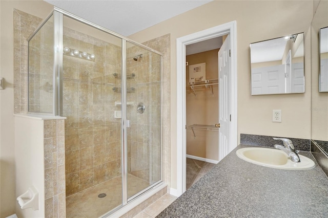 bathroom featuring sink and an enclosed shower