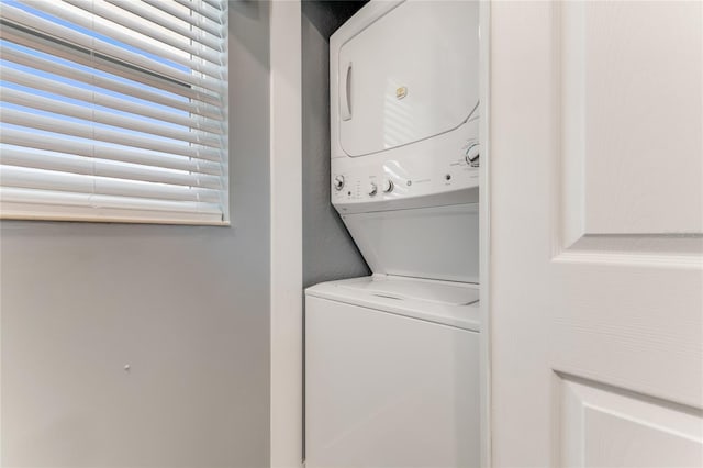 laundry area with stacked washer / drying machine