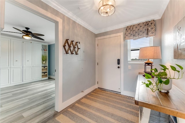 entrance foyer featuring ceiling fan, crown molding, and light hardwood / wood-style flooring