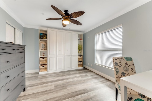 office featuring crown molding, ceiling fan, and light wood-type flooring